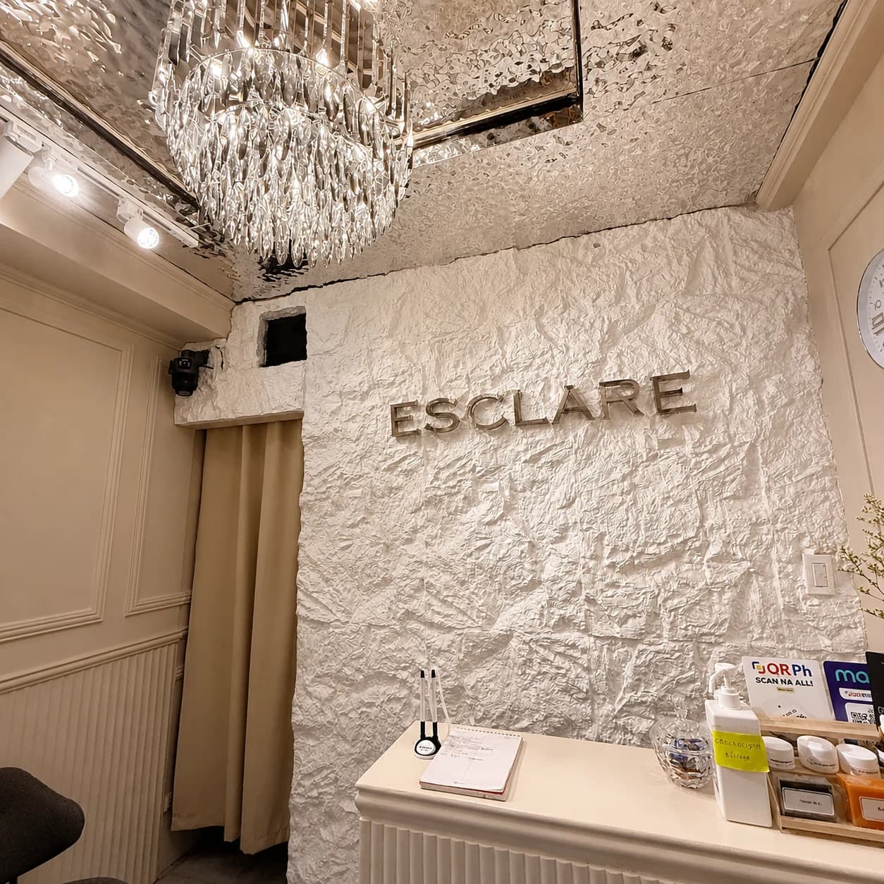 ESCLARE Naga logo wall and crystal chandelier